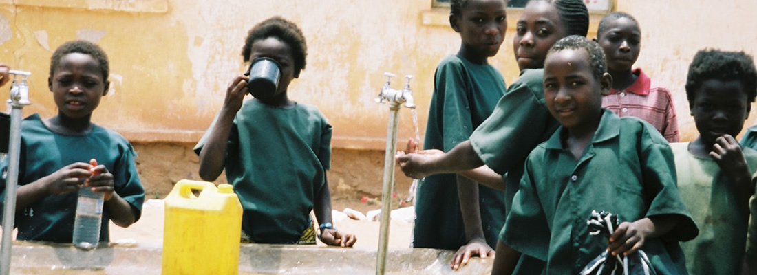 school children at the water taps